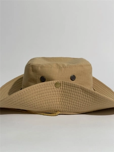 Detail of khaki outdoor bucket hat with breathable mesh vents and adjustable wind rope