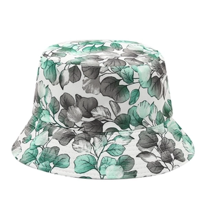 Reversible bucket hat with green eucalyptus leaf print on white fabric for sun protection
