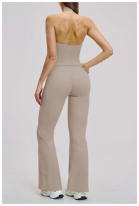 Back view of high-waist yoga set featuring a halter backless top and flared leggings