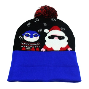 Detail of knitted Christmas hat featuring Santa, snowman patterns and LED power switch