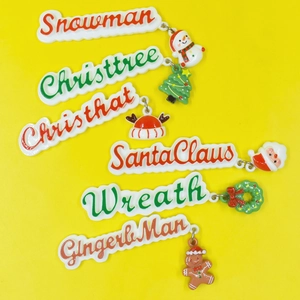 6-piece Christmas resin charm set with Santa, snowman, and tree designs on yellow background