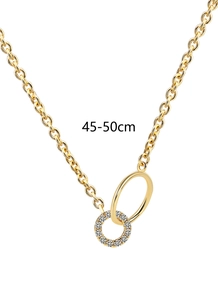 Detail view of interlocking double ring pendant with gold finish and zircon pave accents