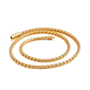 Polished golden stainless steel keel chain necklace with twisted links on white background