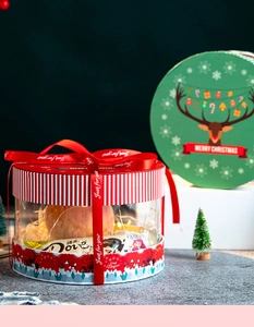 Christmas round transparent gift box with red ribbon LED lights and festive decorations