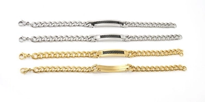 Detail of assorted 18K gold and silver stainless steel Cuban link bracelets for men
