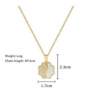 Detail view of gold clover pendant with crystals and white inlay showing exact dimensions