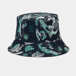 Detailed close-up of streetwear bucket hat featuring mint green graphic patterns on dark fabric
