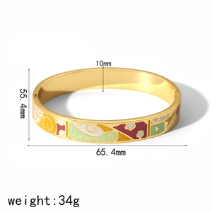 Detail showing 10mm width and inner dimensions of the gold enamel bangle with 34g weight