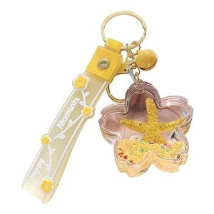 Floral ocean-themed liquid quicksand keychain with yellow starfish and golden sequins