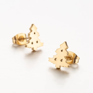Close-up of golden Christmas tree stud earrings with delicate star-shaped cutouts
