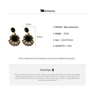 Detail showing dimensions of vintage black and gold rhinestone drop earrings with silver pins