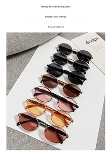 Detail showing various colors of oval metal retro sunglasses with classic stylish lenses