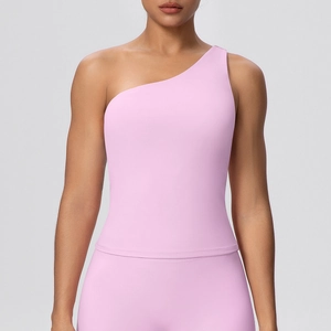 Detail of light pink one-shoulder sports bra showing high elasticity fabric and slim fit