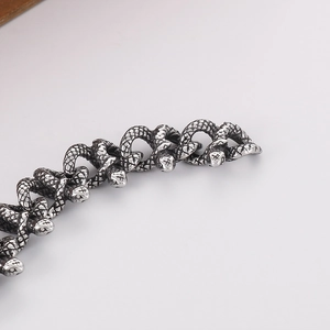 Detailed macro view of retro silver snake bracelet with realistic scale textures