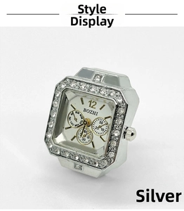 Detail of silver finger watch with rhinestone square case and white dial display