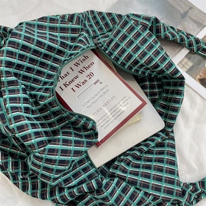 Top view of large plaid tote bag showing ample space for a laptop and books