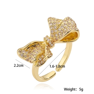 Luxurious 18K gold plated bow ring with sparkling zircons and adjustable open band