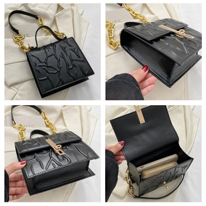 Detail views of black embossed chain bag showing internal capacity and gold hardware