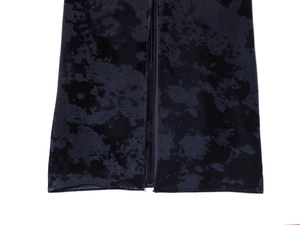 Detail of premium marble embossed black velvet fabric with high-quality hem stitching