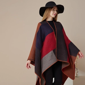 Detail of color-block knit shawl with lock-stitch edges in red, navy, and brown
