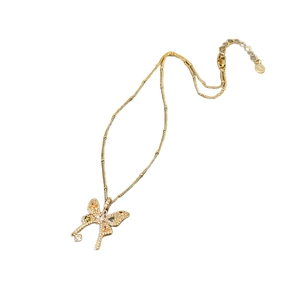 Elegant gold butterfly pendant necklace with multi-color zircon stones on white background