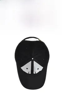 Detail view of black cotton baseball cap showing interior lining and breathable eyelets