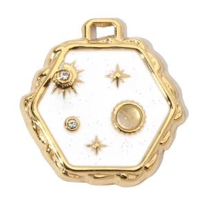 Detailed macro view of a hexagonal gold pendant with white glitter and inset star