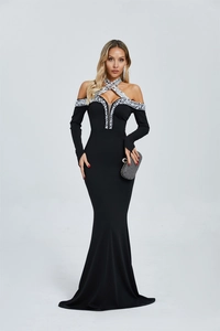 Detail of beaded halter neckline with white pearls and rhinestones on black evening gown