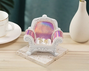 Miniature vintage sofa jewelry display stand with purple silk cushions for earrings