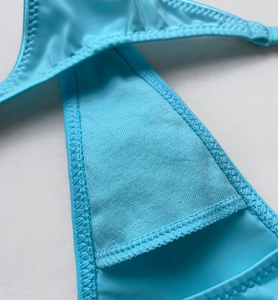 Close-up of sky blue ice silk fabric with premium zigzag stitching and thin strap detail