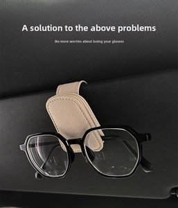 Close-up of beige leather car visor glasses holder showing neat stitching and secure grip
