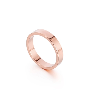 Minimalist 4mm rose gold stainless steel ring with a smooth mirror polished finish