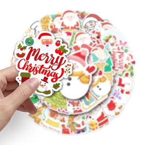 Close-up of waterproof Merry Christmas stickers featuring Santa and snowman patterns