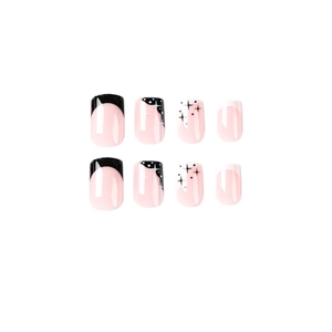 Minimalist black and white French tip press-on nails with star patterns on pink base