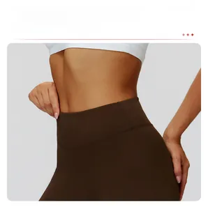 Side view of dark brown high-waisted thermal yoga pants showing waist and hip lines