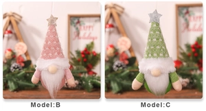 Detail view of pink and green knitted Christmas gnomes with sparkling star hats