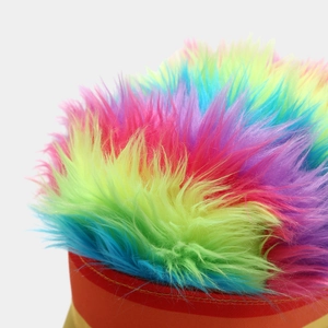 Macro shot of colorful long-hair faux fur texture on a rainbow party baseball cap