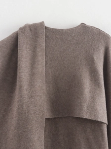 Detailed close-up of brown knit wool coat collar showing soft texture and premium finish