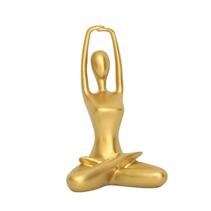 Modern abstract golden yoga sculpture in meditation pose for creative home decor