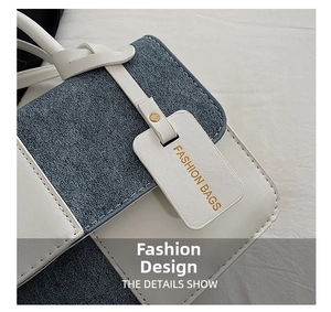 Detailed macro shot of blue denim texture and white leather flap with gold metal buckle
