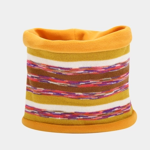 Close-up of multi-color striped knitted neck warmer with thick orange fleece lining