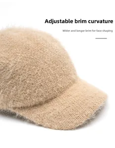 Detail of oatmeal knit baseball cap featuring foldable wide brim and fuzzy rabbit fur texture