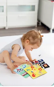 Detail of baby sensory tissue box toy with soft high-contrast animal patterns and crinkle fabric