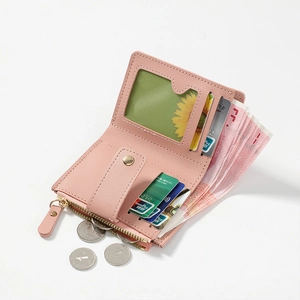 Pink PU leather wallet interior detail showing card slots and zippered coin pocket