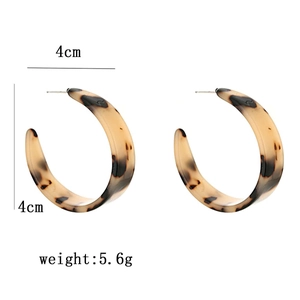 Detail view of 4cm amber tortoise shell resin hoop earrings showing size and weight
