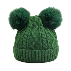 Winter chunky knit double pompom beanie in dark green forest color with cable pattern