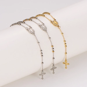 Three beaded stainless steel rosary necklaces in gold, silver, and dual-tone finishes