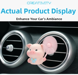 Detailed view of a pink cartoon pig car air freshener with rotating propeller fan blades