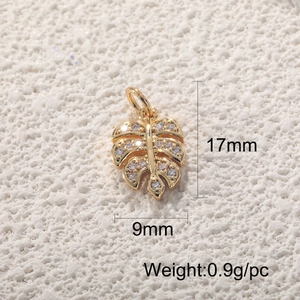 Detail of 17mm gold leaf pendant with crystal zircon inlay and precise dimensions