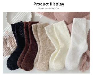 Flat lay of colorful thick faux mink socks with soft plush texture and heart embroidery